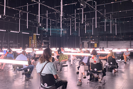 audience seated on stage during the production of blindness